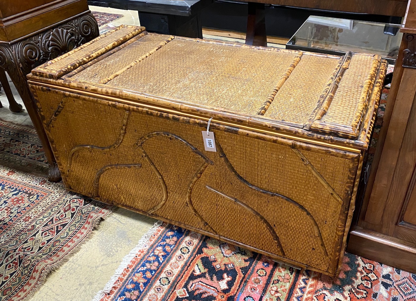 An early 20th century bamboo and rattan trunk, width 110cm, depth 52cm, height 56cm